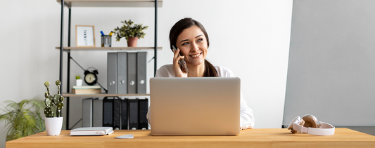 Happy customer working at a home office desk