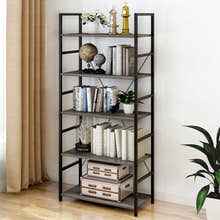 Tall wood and metal bookshelf with books and decorative items 