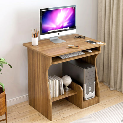 Wooden computer desk with a monitor, keyboard, and other items in a room setting.